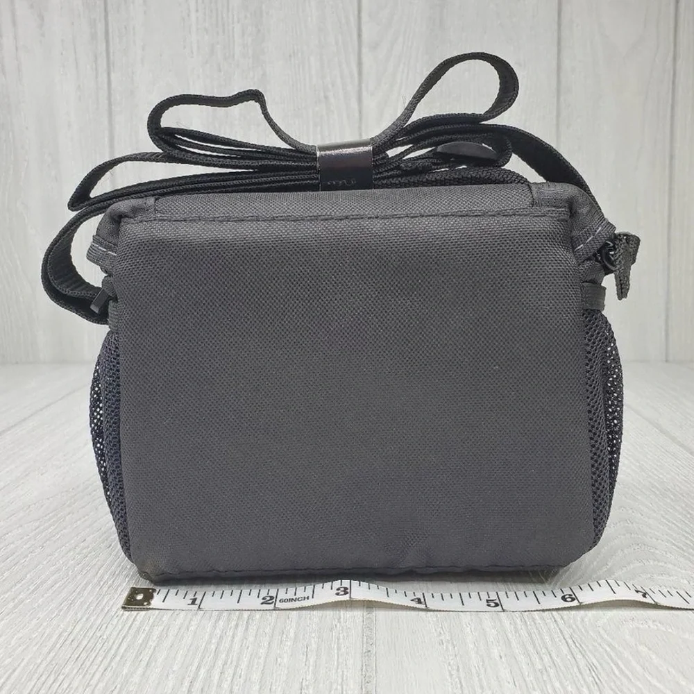 Sony black camera bag. Durable material. Secure strap and buckle. NWOT